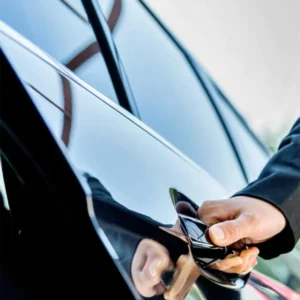 a person opening a car door