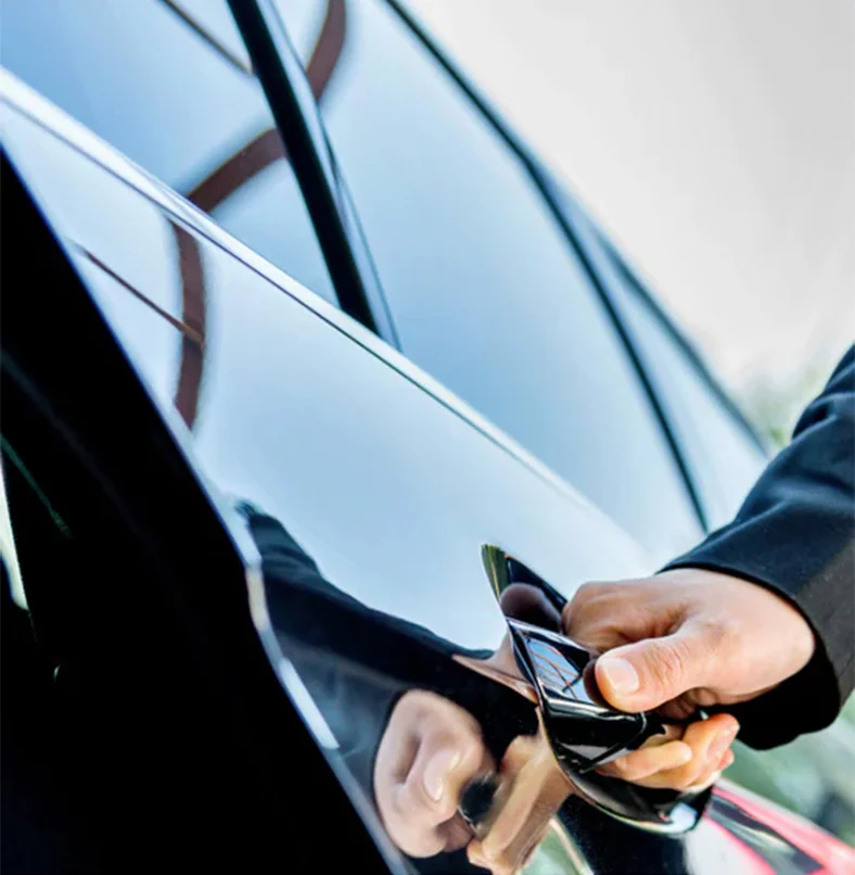 a person opening a car door