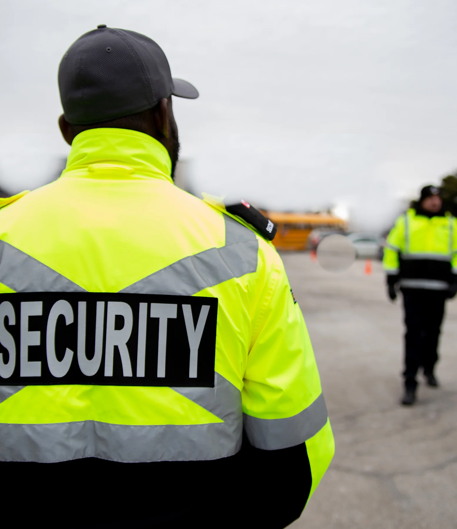 back of a security guard wearing hi-vis